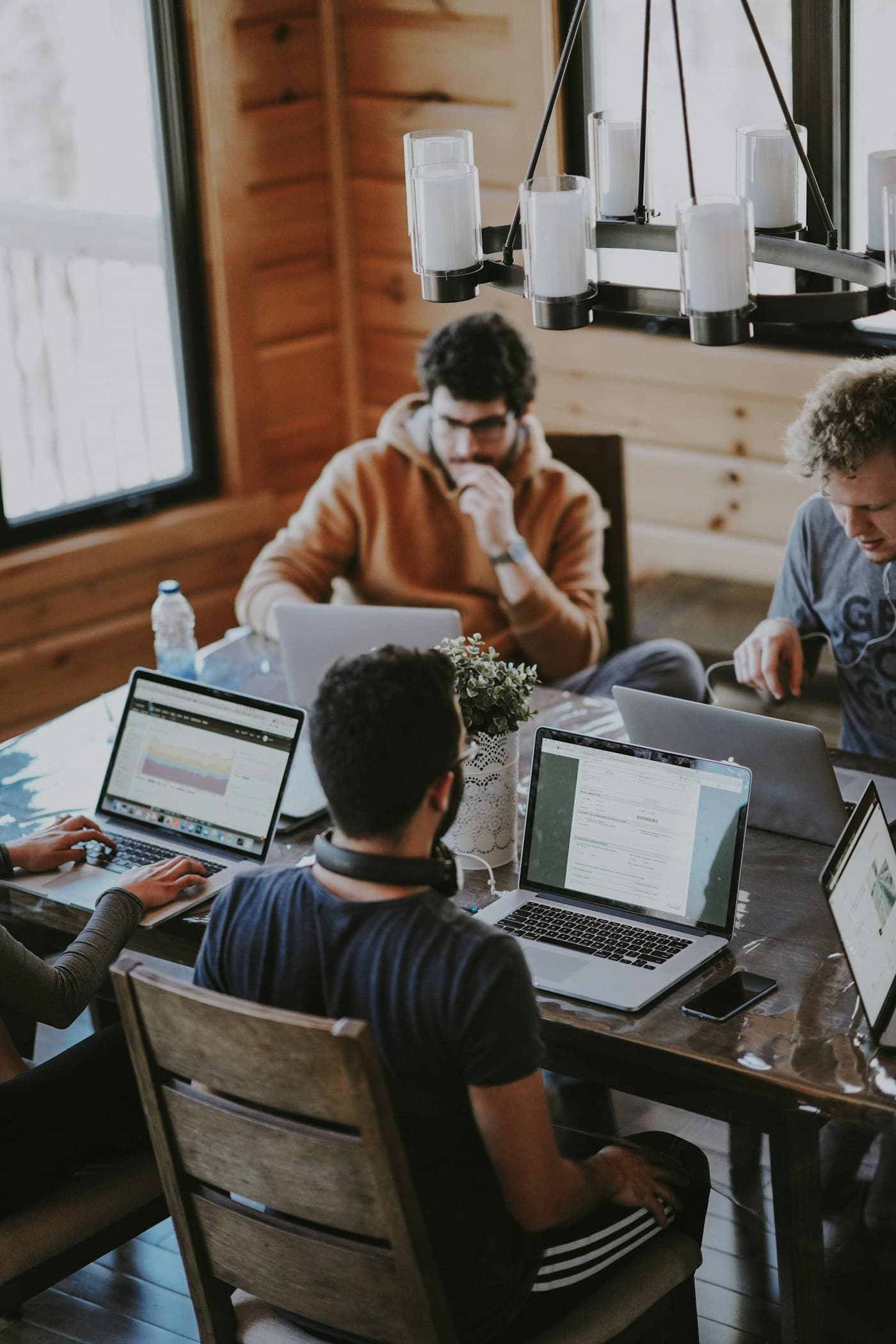 Professionals collaborating around a shared work table